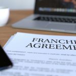 Copy of franchise agreement on the desk
