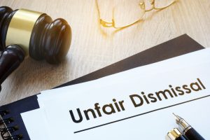 Documents unfair dismissal and gavel in a court